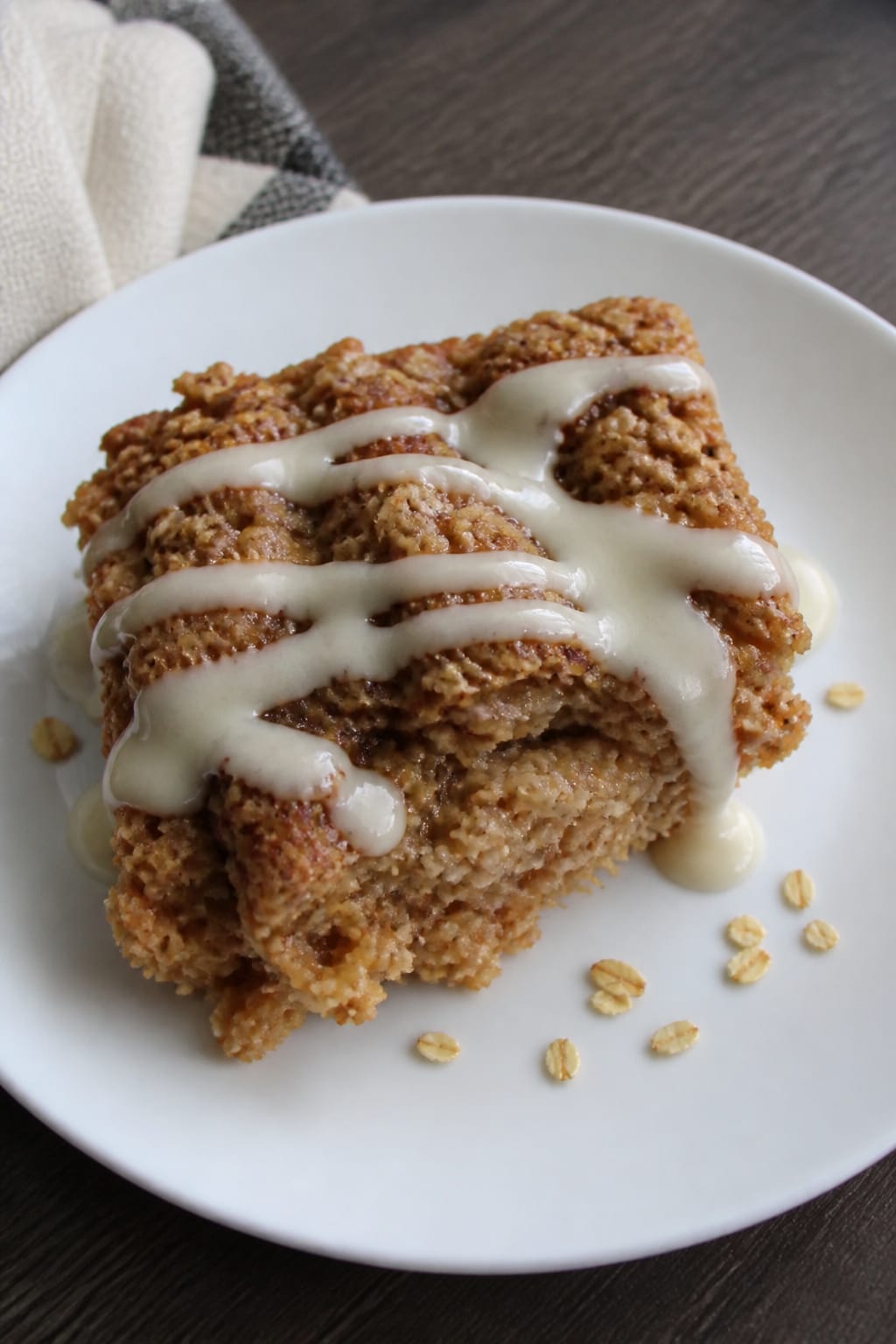Cinnamon Roll Baked Oatmeal With Cream Cheese Drizzle 1 Same recipe photoshoot, same home kitchen, same natural window light, same smartphone camera style,