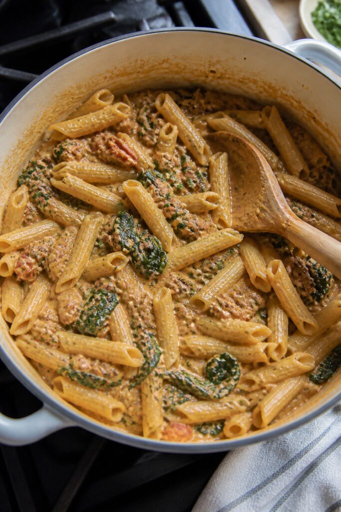 One Pot Tuscan Sausage Spinach Pasta - A Simple Weeknight Dinner 2 Same recipe photoshoot, same home kitchen, same natural window light, same smartphone camera style,