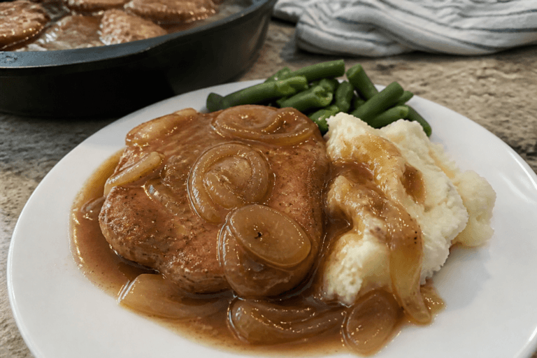 Smothered boneless pork chops with onion gravy